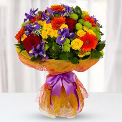 Bouquet with irises, gerberas and bush roses